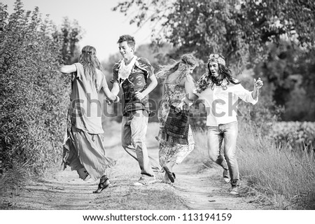 Hippie Group Dancing in the Countryside,Italy