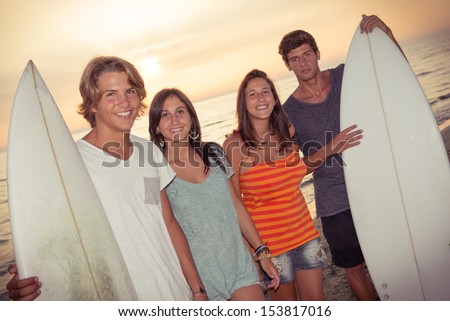 Group of Friends with Surf Boards,Italy