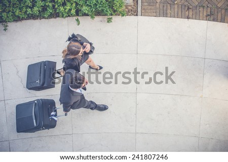 Business People Walking with Trolley Bag, Aerial View