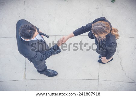 Business People Giving Handshake, Aerial View