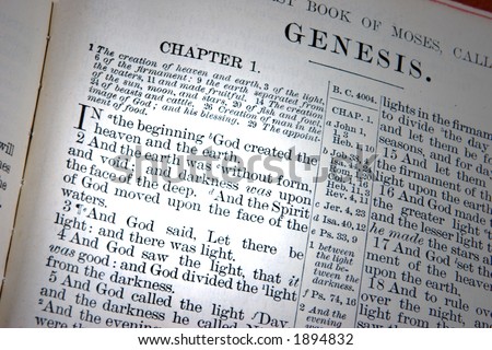 A bible opened to the first chapter of Genesis, the creation.