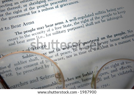 The second amendment to the United States constitution is shown, highlighted by a beam of light.