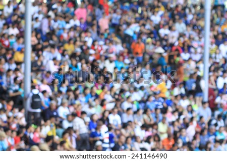 A blurred crowd in a stadium