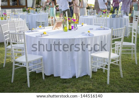 Table  with people on background at  wedding reception