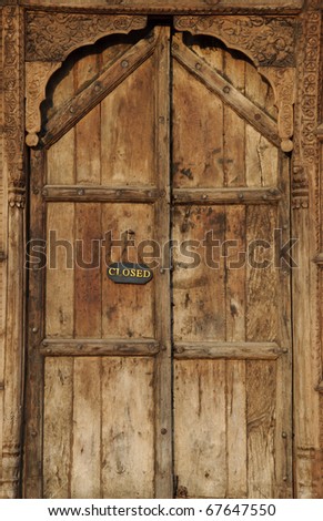The close sign on a wooden door and thai style / Close sign on a wooden door