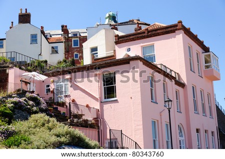 pink houses on hill