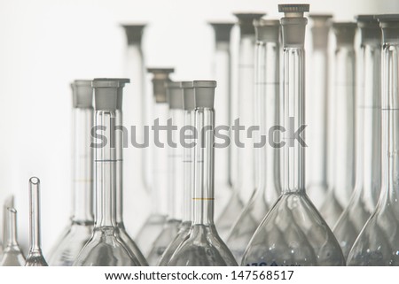 Close up of many transparent glass beakers