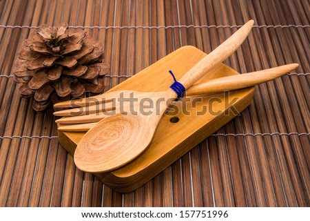 wood spoons and wood fork on wood backgrounds