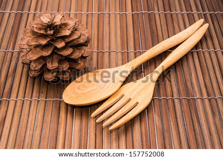 wood spoons and fork on wood backgrounds