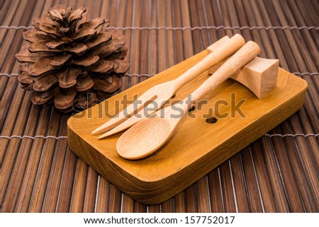 wood spoons and fork on wood backgrounds
