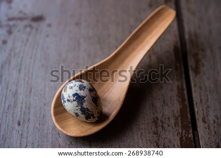 quail eggs in wood spoons