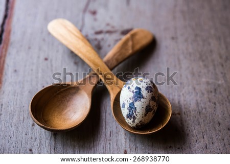 quail eggs in wood spoons