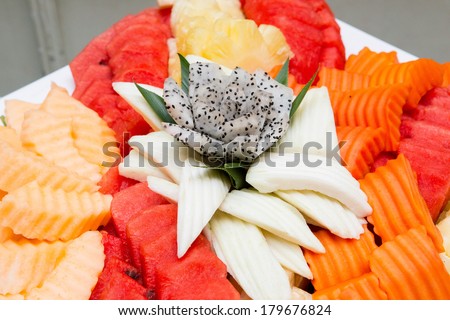 Fruits on plate with carved