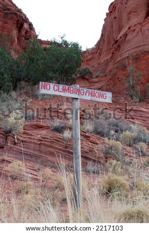 a no climbing/hiking sign at the Red Rocks near Jemez Pueblo