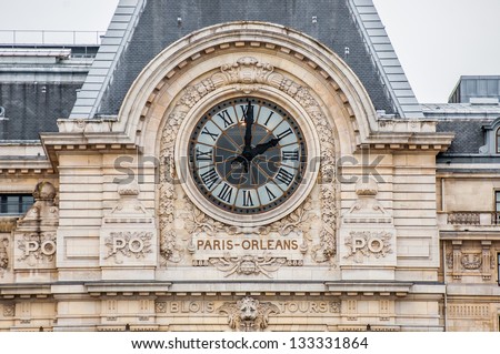 PARIS - FEBRUARY 3: clock on the facade of the Musee d\'Orsay on February 3, 2013 in Paris. The museum building was originally a railway station.