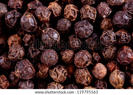 background of black peppercorns