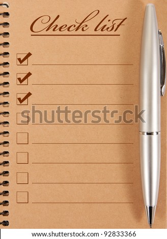 Blank note paper with pen. isolated on white.