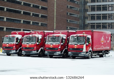 IPSWICH, UK - MARCH 24: Royal Mail trucks snowed-in. Severe weather conditions are causing disruptions to services in many parts of Northern England on 23-24 March 2013.