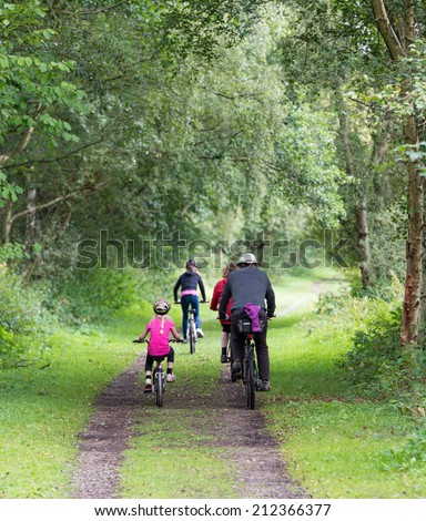 family cycling in the Consall Valley popular with tourists in Staffordshire