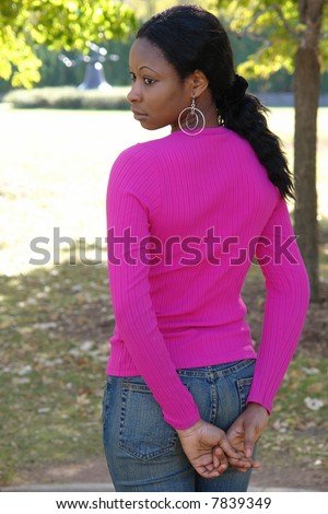 A picture of beautiful woman standing with profile