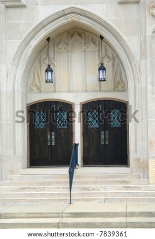 A picture of two double doors of church building