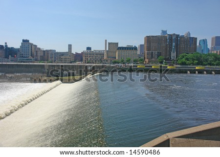 A picture of Minneapolis skyline across from dam