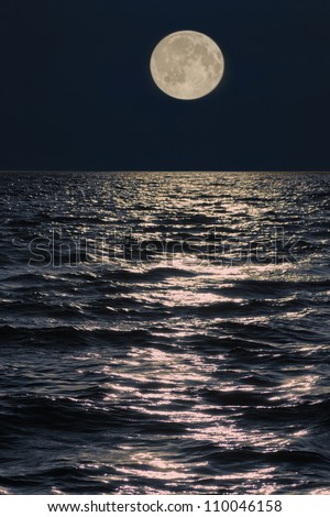 full moon over the sea at night