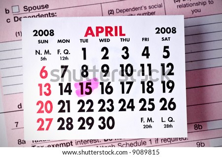 Federal Tax Form Below a Calendar-April, 2008. (DOF) Focus is on the calendar page.