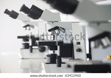3 microscopes in laboratory for micro organisms.