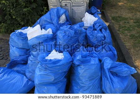 closeup of blue dustbin bags