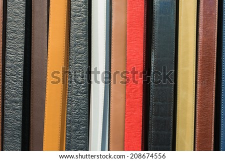 Collection of Colorful Belts on Rack (No Brand Names)