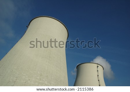 Image of big energy power towers, producing white smoke. Concept: how energy is born.
