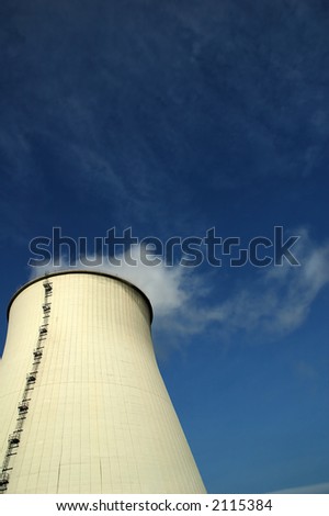 Image of power plant, White tower producing white smoke. Concept: how energy is born.