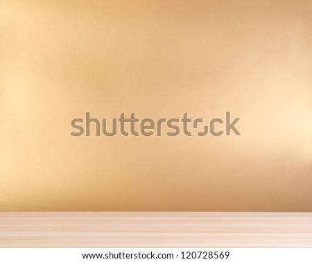 wooden table and golden background