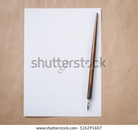 a letter on brown paper background