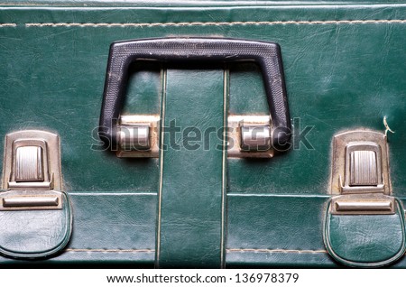 a old green bag with buckle