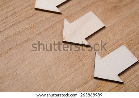 wood  arrow with tag on sack background