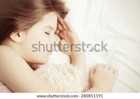 little girl sleep with teddy-bear, vintage color