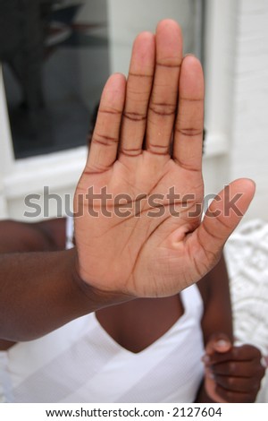 This is an image of a girl with her palm up. As if to say \