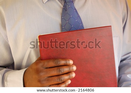 This is an image of businessman prepared for his interview.(portfolio in hand).