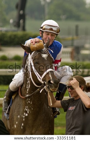 LOUISVILLE, KY - JUNE 14: Jockey Calvin Borel cools down his horse, \