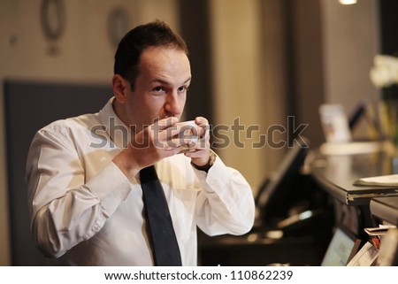 Man at work in the office with morning coffee