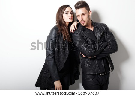 Portrait Of Young Couple In Love Posing At Studio