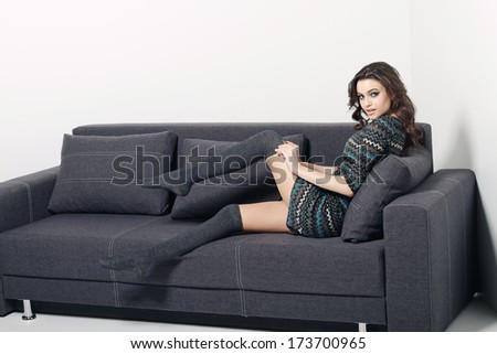 Sofa Woman relaxing enjoying luxury lifestyle outdoor day dreaming and thinking looking happy up smiling cheerful. Beautiful young multicultural Asian Caucasian female model in her 20s.