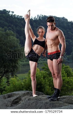 Athletic man and woman outdoor.Fashion photo