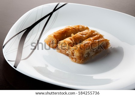 traditional Turkish arabic dessert - baklava with honey and nuts