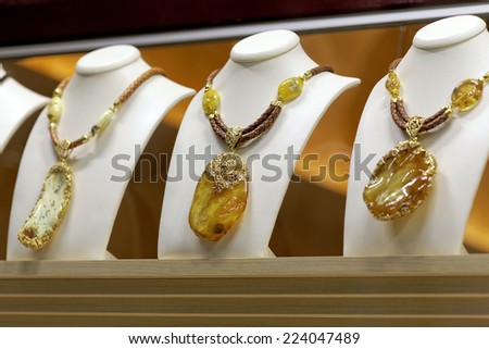 Presentation of retail showcase in jewelry store with necklaces and other jewelry