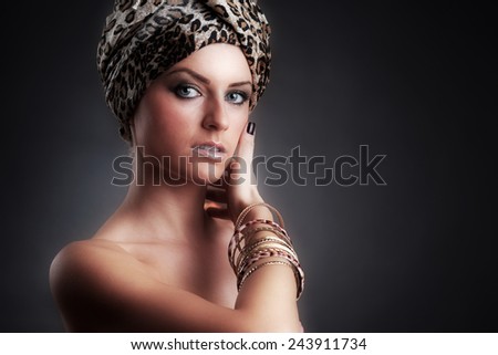 Egyptian Style Woman. Golden Jewels. Egypt Styled Makeup. Gold Light. Jewellery