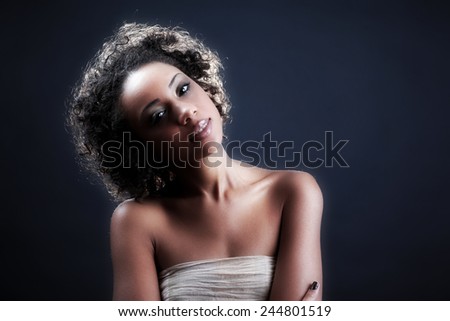Fashion Girl. Beautiful Makeup and Healthy Hair. Beautiful smiling african american girl. Beauty Model Woman Face. Perfect Skin. Professional Make-up.Fashion Art.Vogue Style.