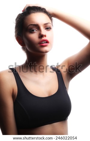 Sports girl, studio shot. isolated over white background.Sexy young and fit female fighter posing in combat poses